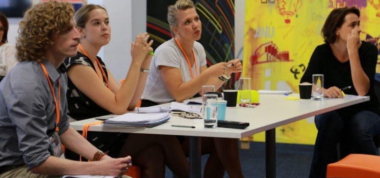 Four people sitting at a table
