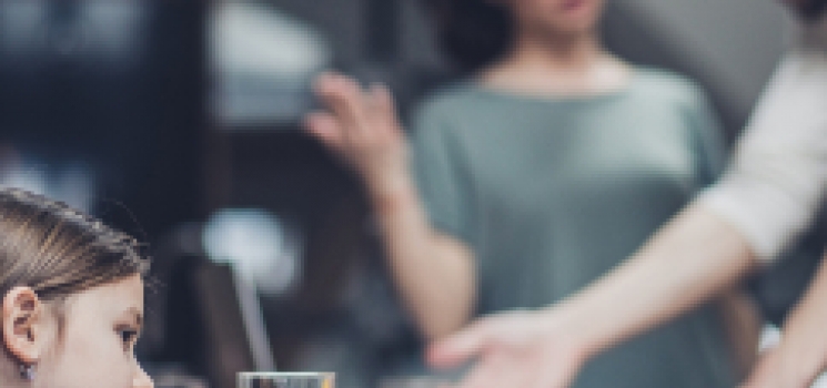 blurred image unhappy family scene in kitchen